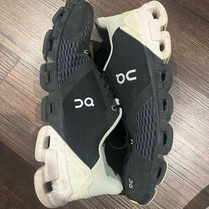 On Running Black and Cream Athletic Shoes